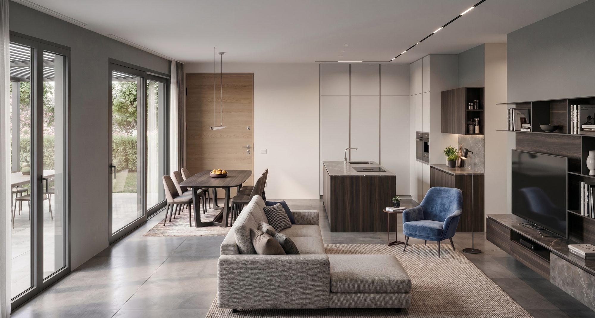Zona living open space con cucina, soggiorno e uscita sul giardino